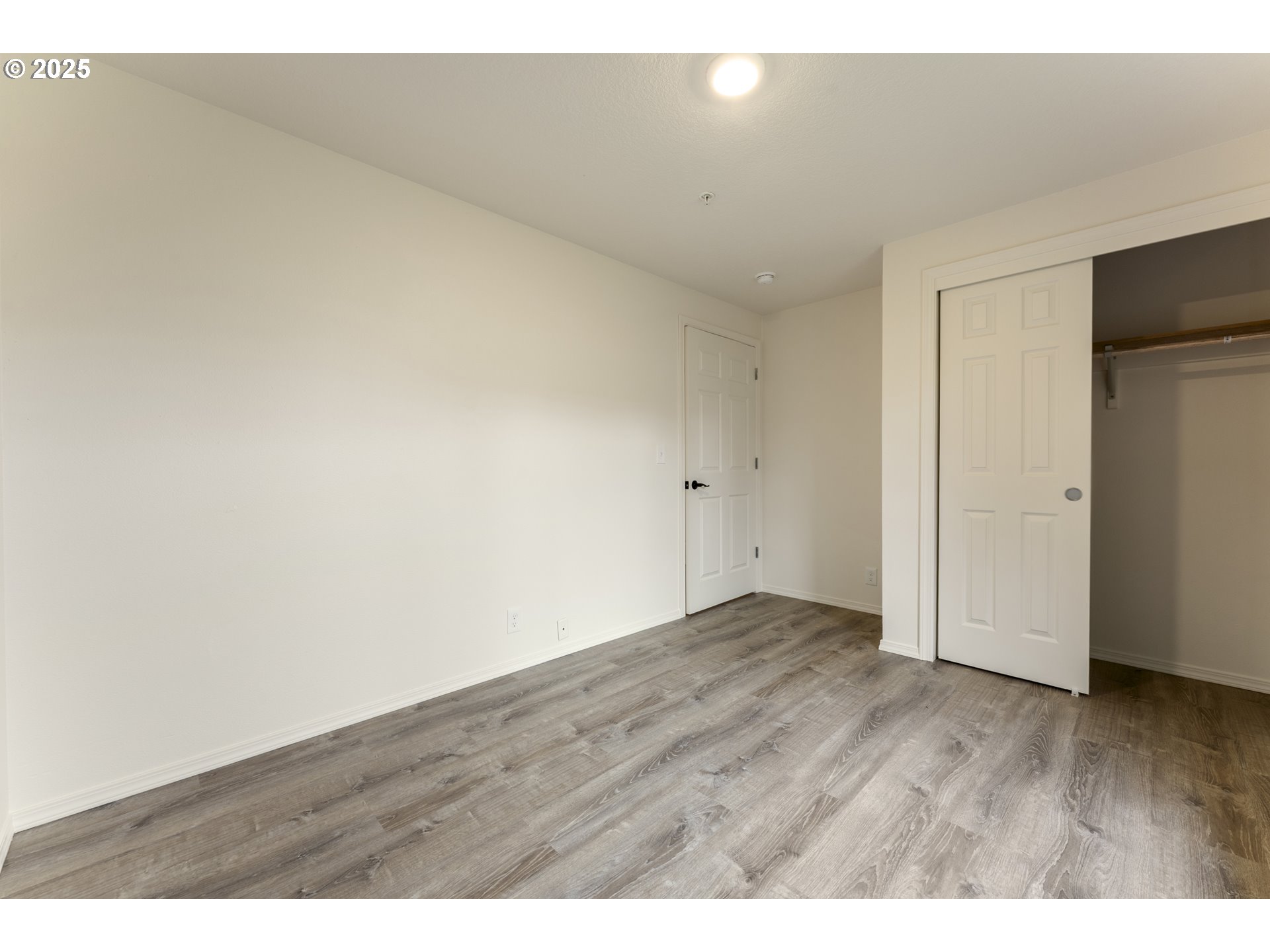 1530 Southeast 5th Street Gresham, OR 97080 - Photo 19 of 39 a view of an empty room with wooden floor