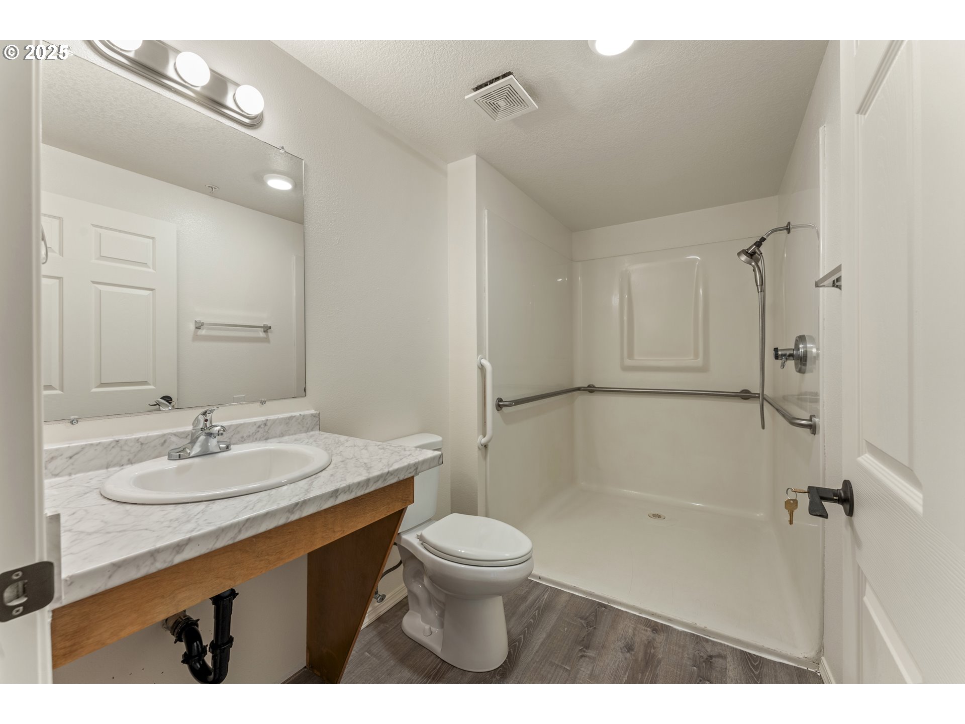 1530 Southeast 5th Street Gresham, OR 97080 - Photo 23 of 39 a bathroom with a sink a toilet and shower