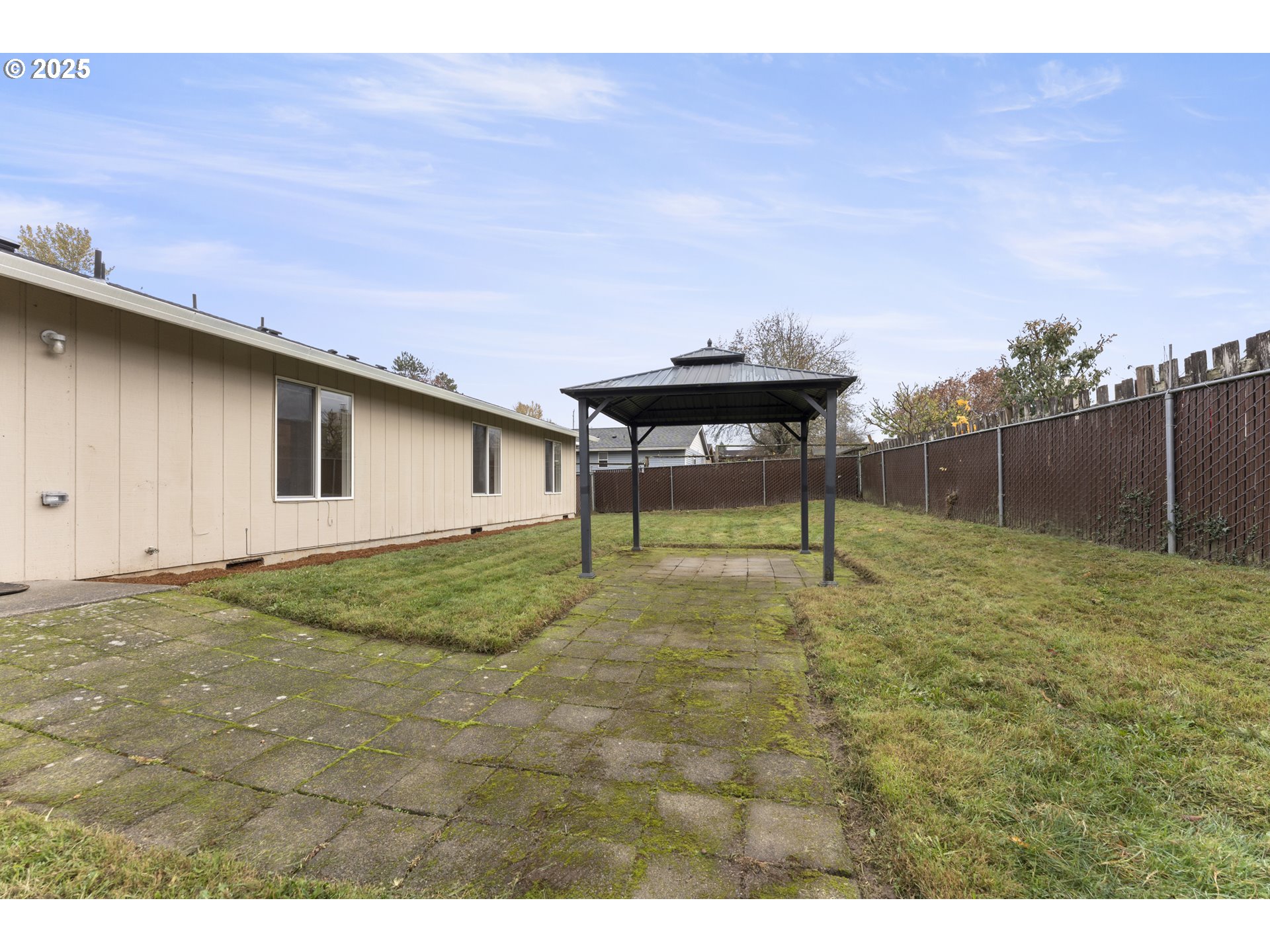 1530 Southeast 5th Street Gresham, OR 97080 - Photo 33 of 39 a backyard of a house with table and chairs