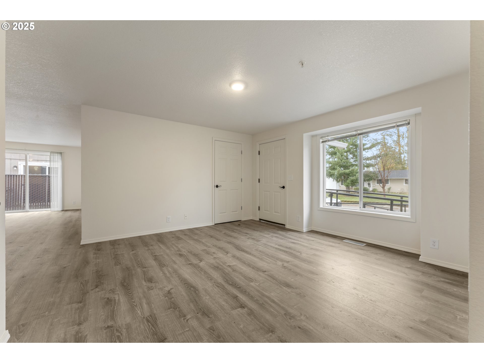 1530 Southeast 5th Street Gresham, OR 97080 - Photo 4 of 39 a view of an empty room with a window