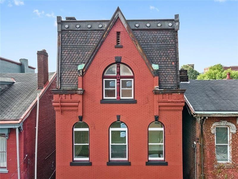 1005 Sheffield Street Pittsburgh, PA 15233 - Photo 2 of 11 a view of a brick house with large windows