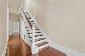 a view of an entryway with wooden floor