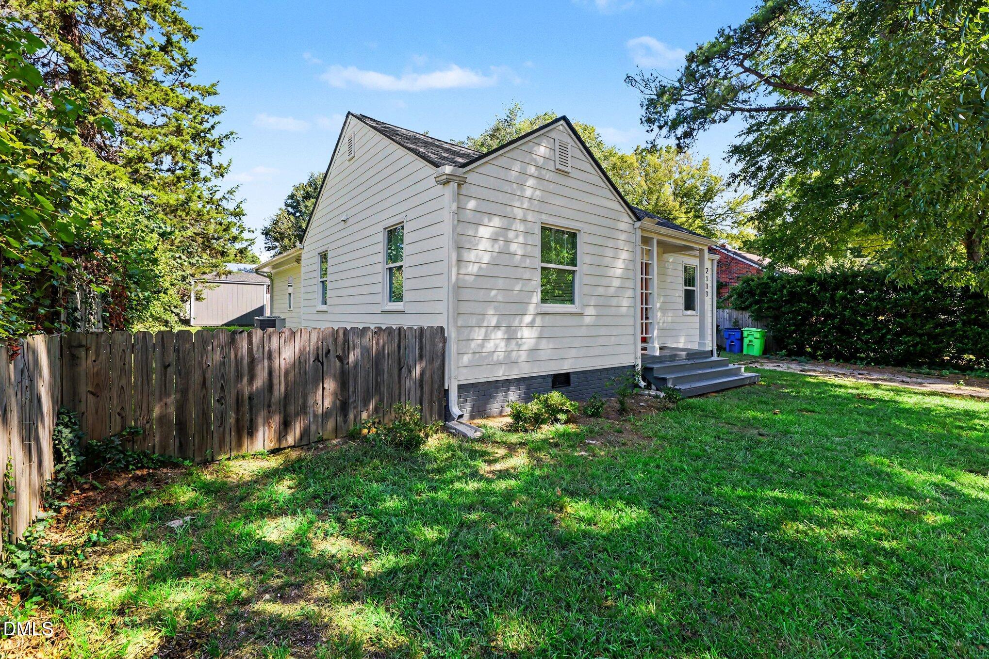 2111 Milburnie Road Raleigh, NC 27610 - Photo 27 of 27 Additional front view shows wood fencing.
