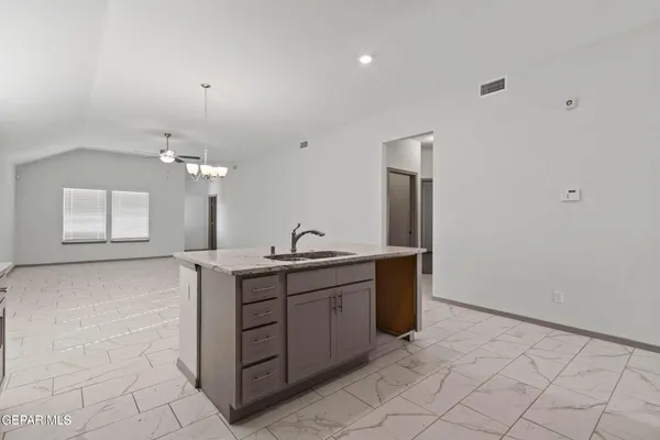 a spacious bathroom with a double vanity sink and a mirror