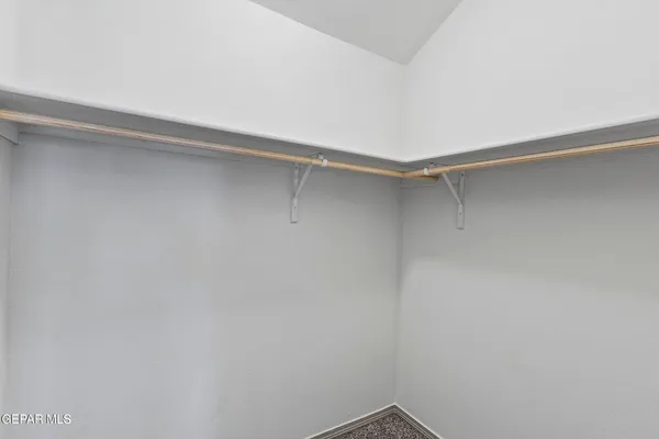 a view of a room with shelf on the wall