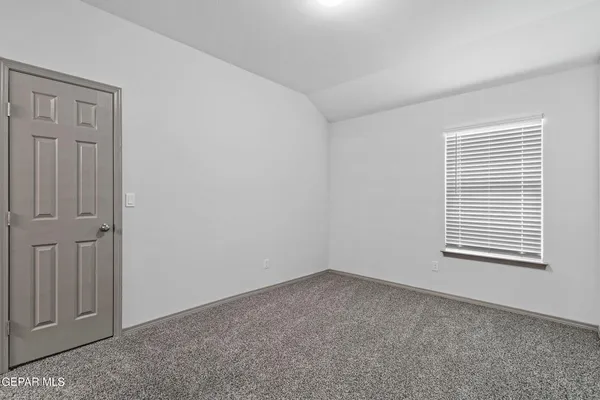 a view of a room that has a window in it
