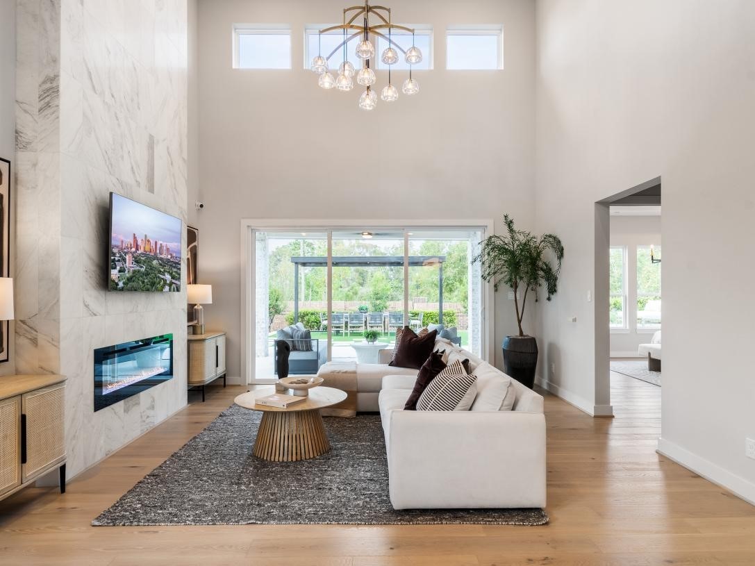 4938 Northern Wds Drive Spring, TX 77386 - Photo 5 of 11 a living room with furniture and a fireplace