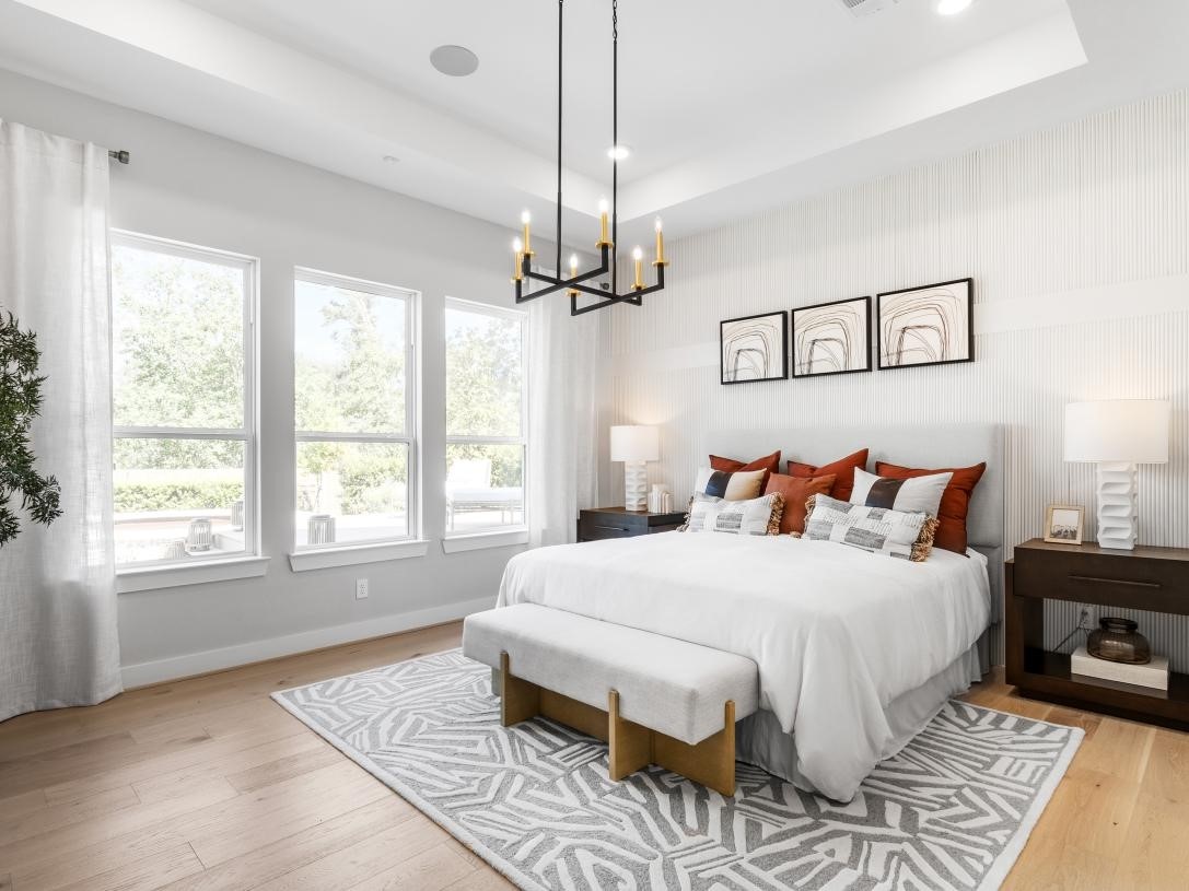 4938 Northern Wds Drive Spring, TX 77386 - Photo 9 of 11 a bedroom with a large bed and a window