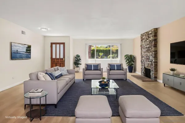 a living room with fireplace furniture and a flat screen tv