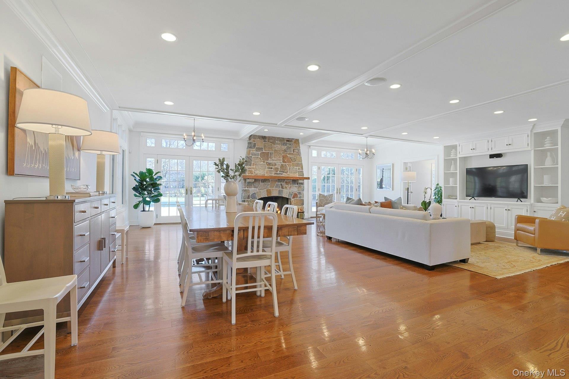 369 Evandale Road Scarsdale, NY 10583 - Photo 14 of 49 Additional view of the great room, capturing the airy dining area and light filled living room.