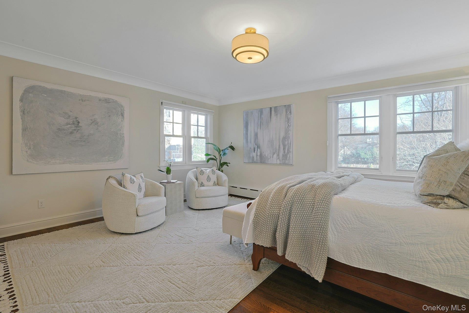 369 Evandale Road Scarsdale, NY 10583 - Photo 24 of 49 Another view of the primary bedroom, highlighting the generous scale, soft natural light, and multiple windows throughout.