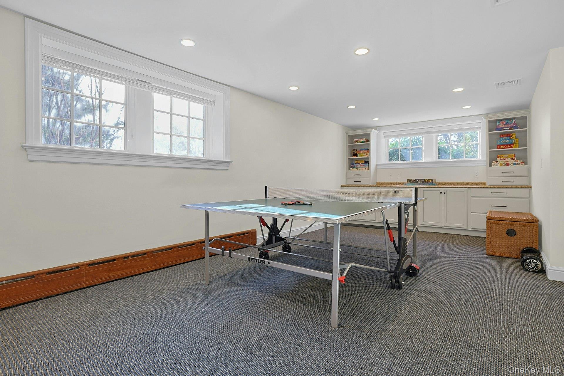 369 Evandale Road Scarsdale, NY 10583 - Photo 35 of 49 This lower level recreation area is great for larger games tables and boasts built-in cabinetry for toys and games.