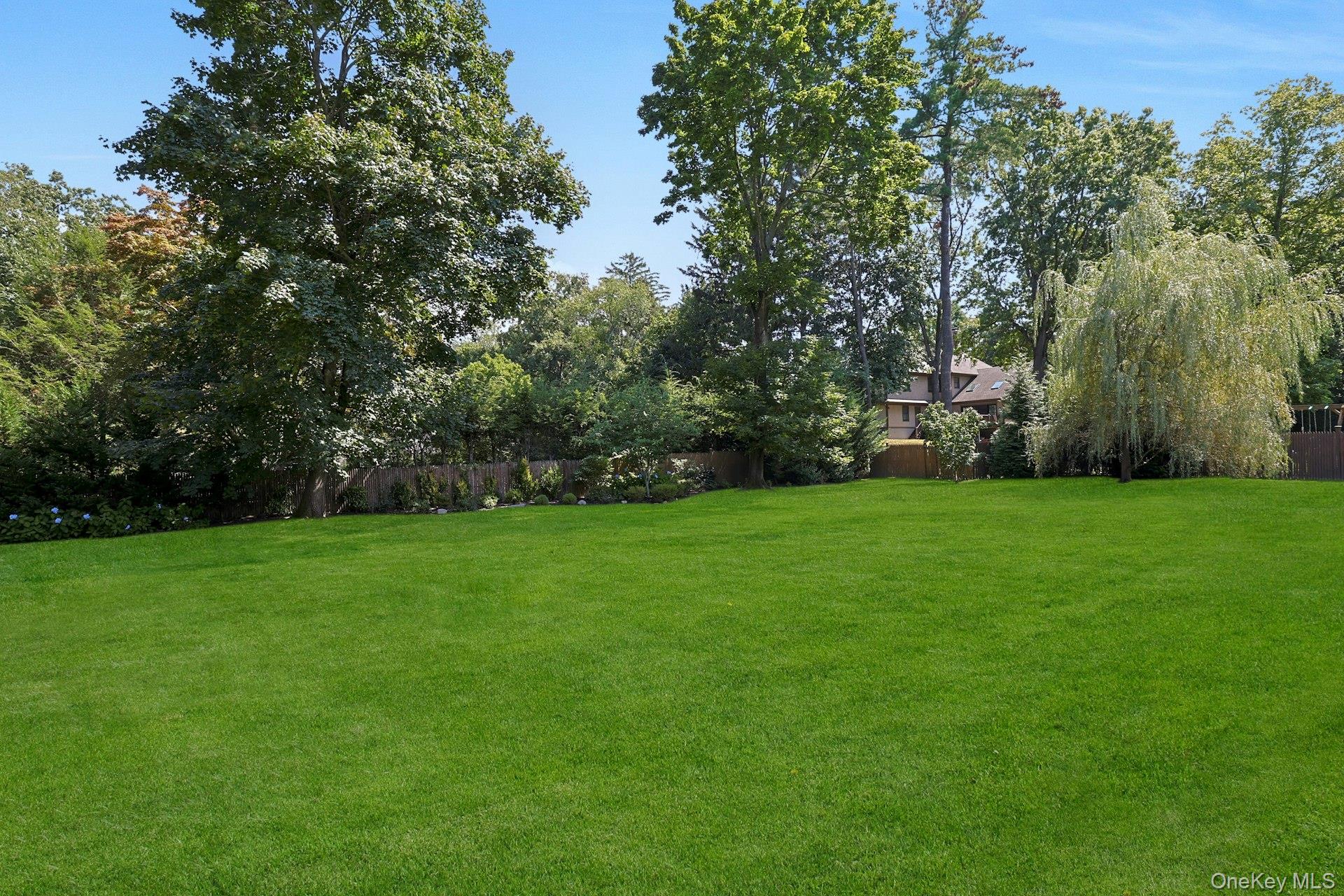 369 Evandale Road Scarsdale, NY 10583 - Photo 39 of 49 Lush, level landscaped grounds with sweeping green space for outdoor fun, entertaining, and quiet enjoyment.