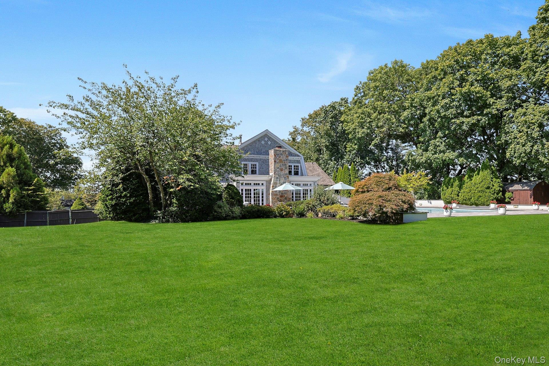 369 Evandale Road Scarsdale, NY 10583 - Photo 4 of 49 Wide lawn view highlighting the park like property, privacy, and exceptional space for play, entertaining, and relaxing.