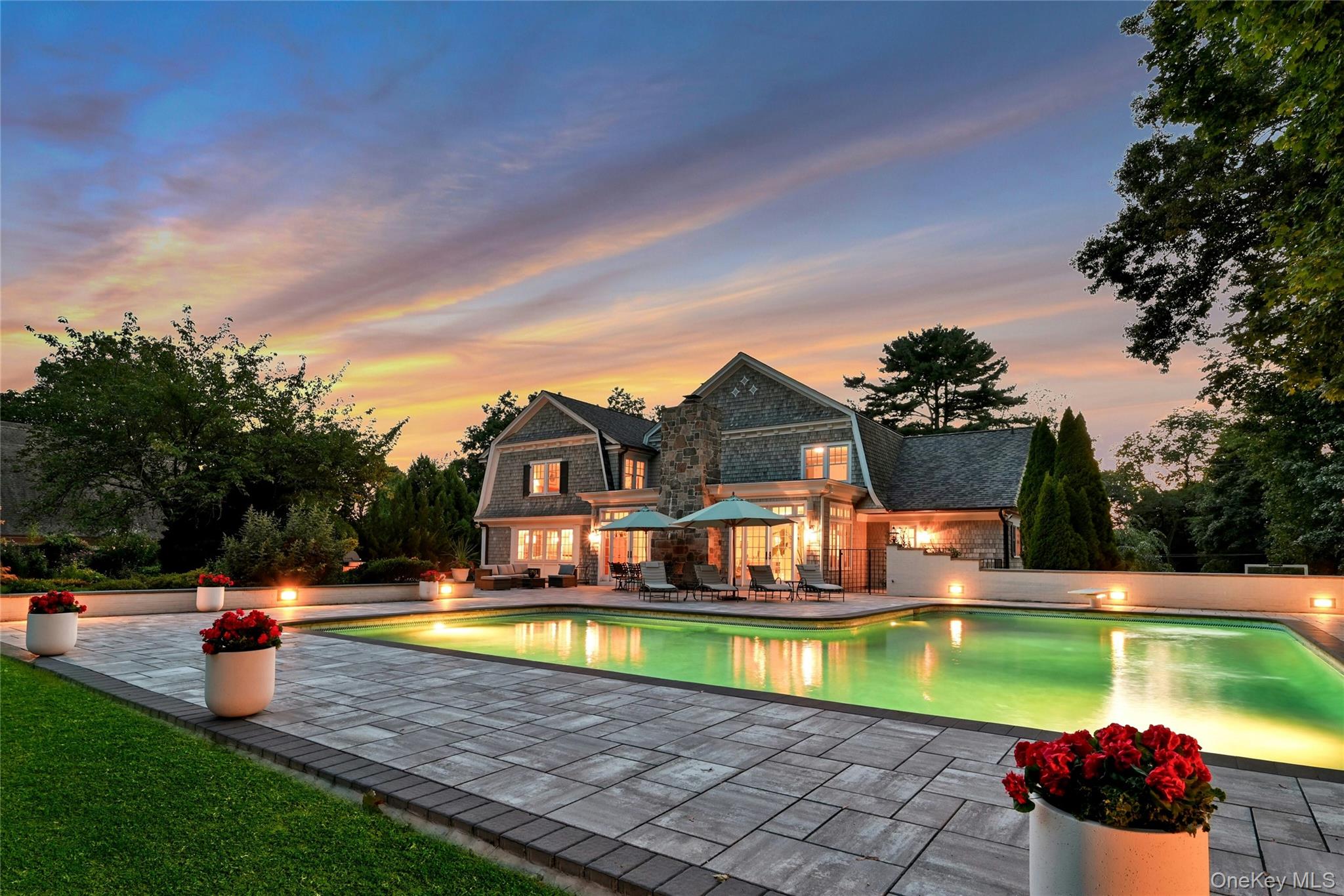 369 Evandale Road Scarsdale, NY 10583 - Photo 41 of 49 Evening ambiance at its best, showcasing the stunning resort style pool.