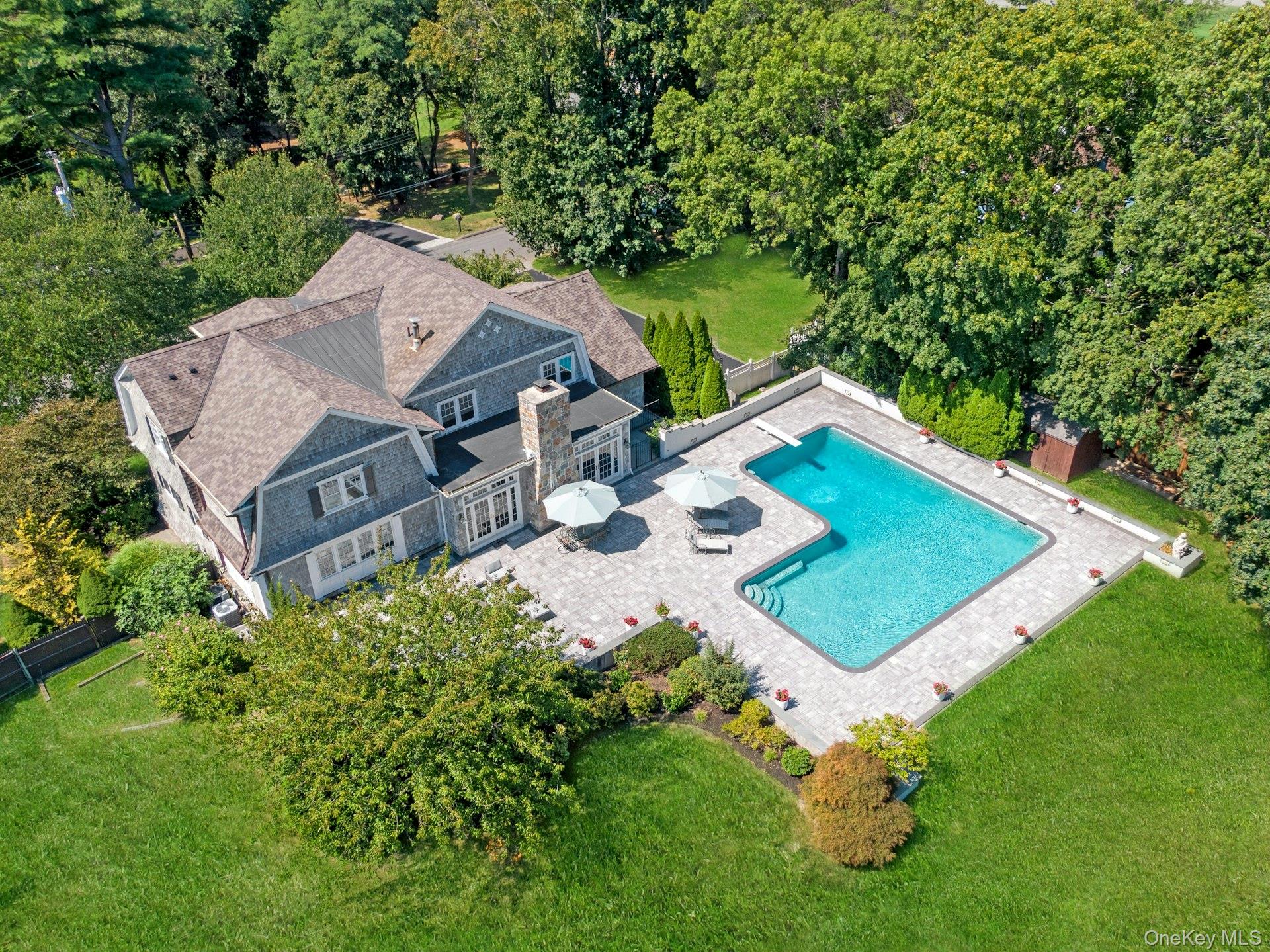 369 Evandale Road Scarsdale, NY 10583 - Photo 42 of 49 Bird’s eye view of an ideal backyard retreat with pool and patio amidst the beautifully landscaped property.