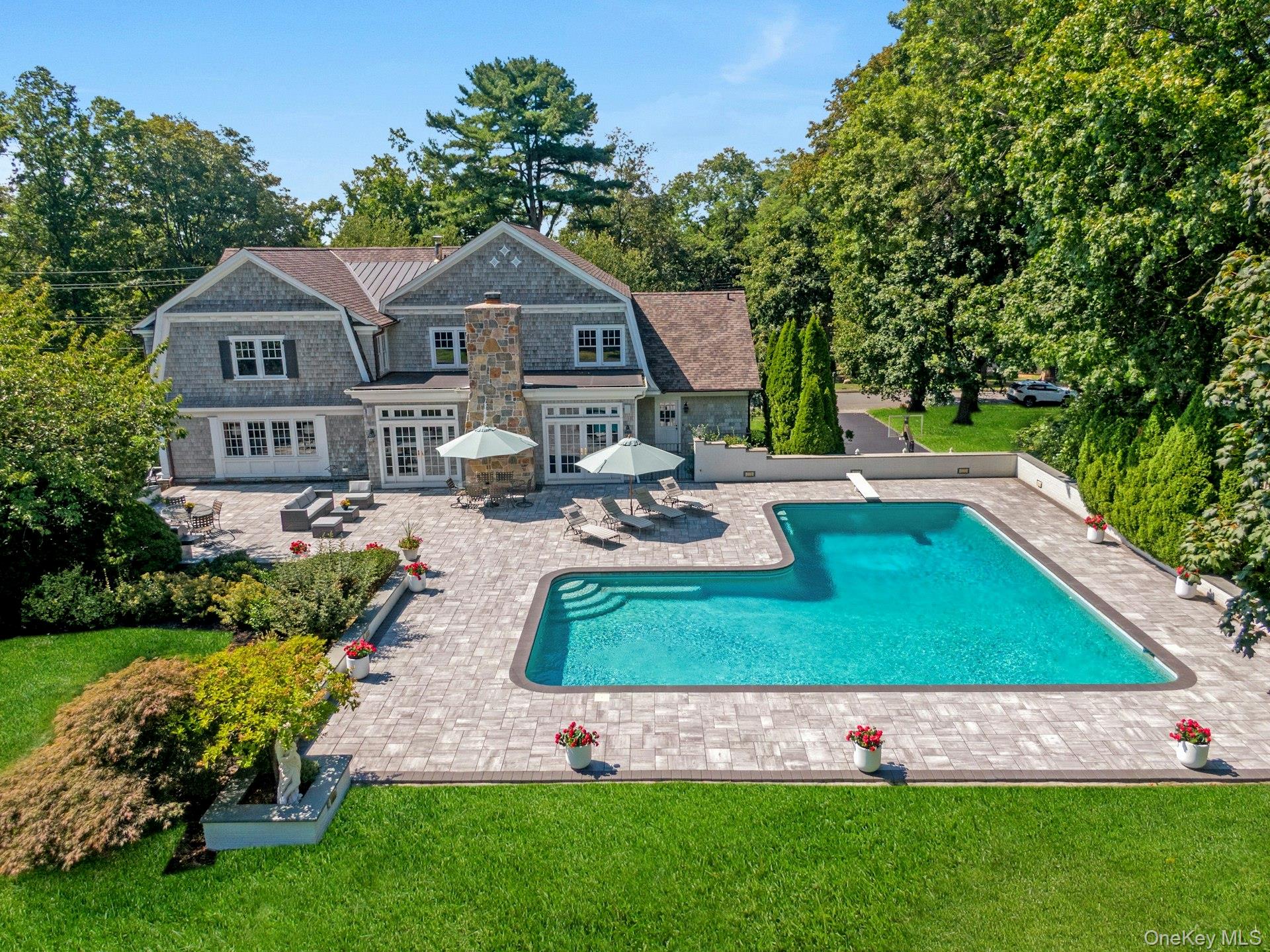 369 Evandale Road Scarsdale, NY 10583 - Photo 43 of 49 Up close look at the poolside retreat, with ample room for lounging, dining, and entertaining outdoors.