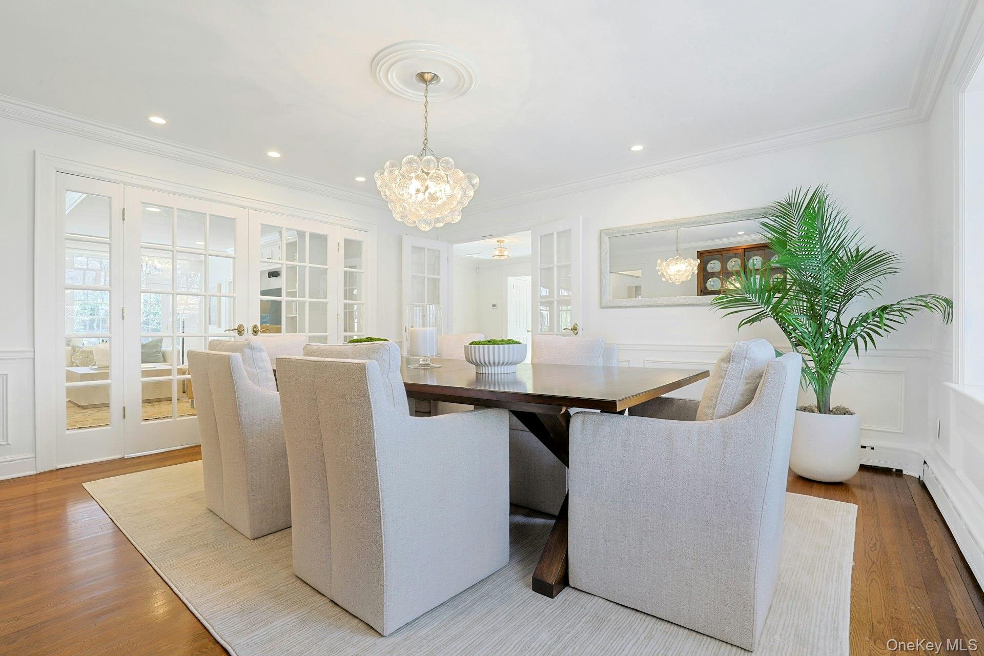 369 Evandale Road Scarsdale, NY 10583 - Photo 8 of 49 Another view of the formal dining room, ideally positioned with open access to the large family living area and kitchen for effortless entertaining.