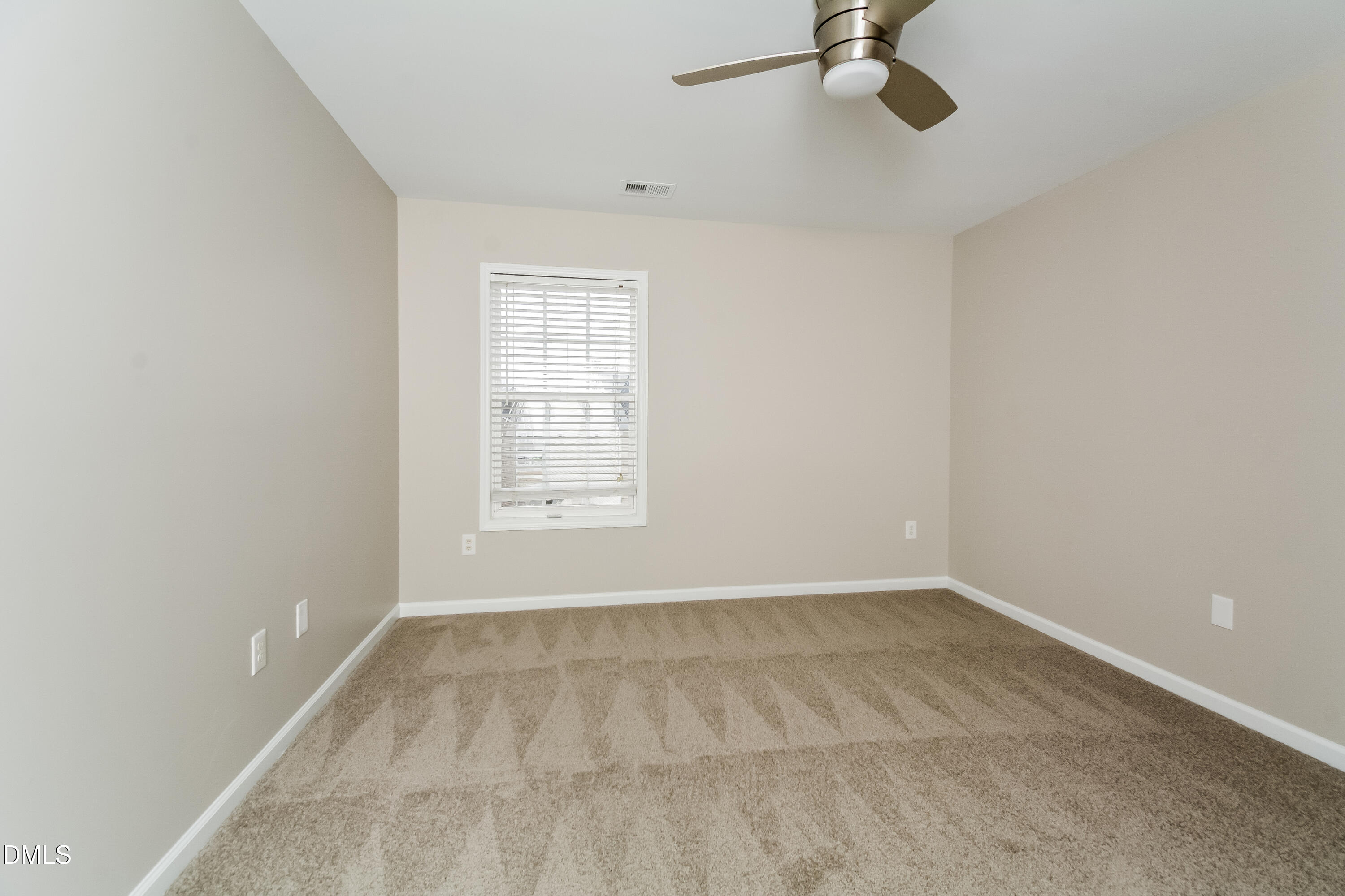 1413 Cozart Street Durham, NC 27704 - Photo 11 of 17 a view of an empty room with a window