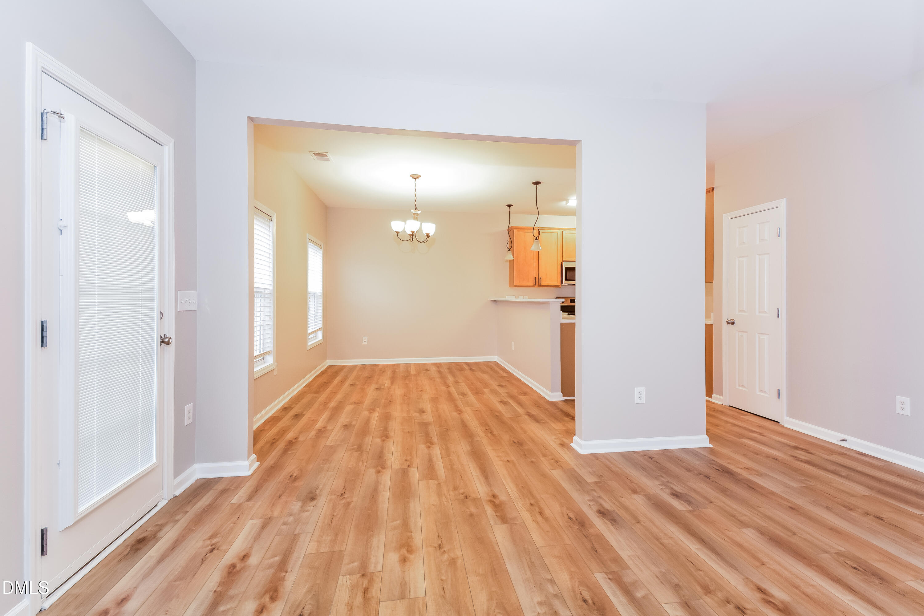 1413 Cozart Street Durham, NC 27704 - Photo 3 of 17 a view of a room with wooden floor and a bathroom