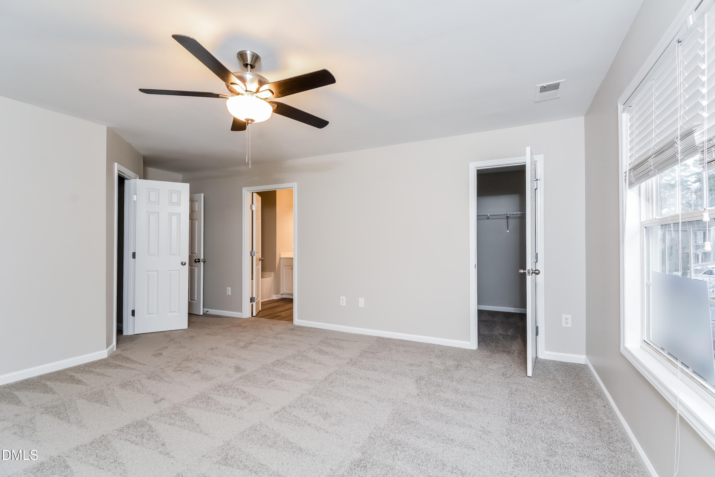 1413 Cozart Street Durham, NC 27704 - Photo 6 of 17 a view of an empty room with window and ceiling fan