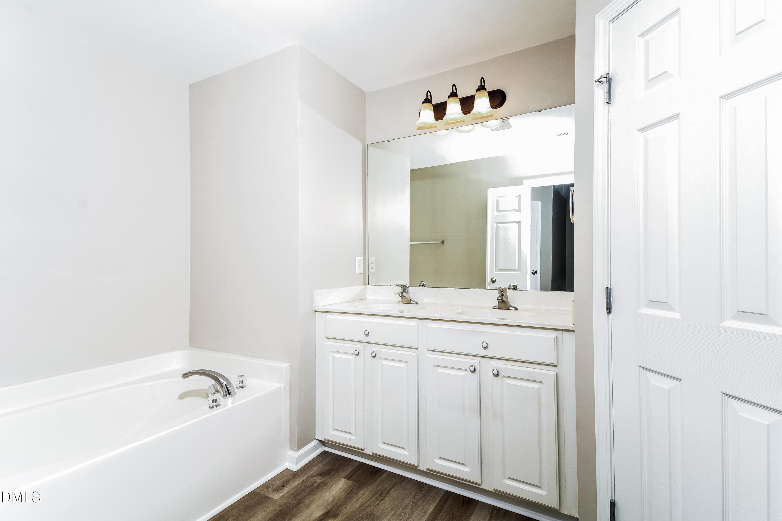 1413 Cozart Street Durham, NC 27704 - Photo 8 of 17 a bathroom with a tub sink and mirror