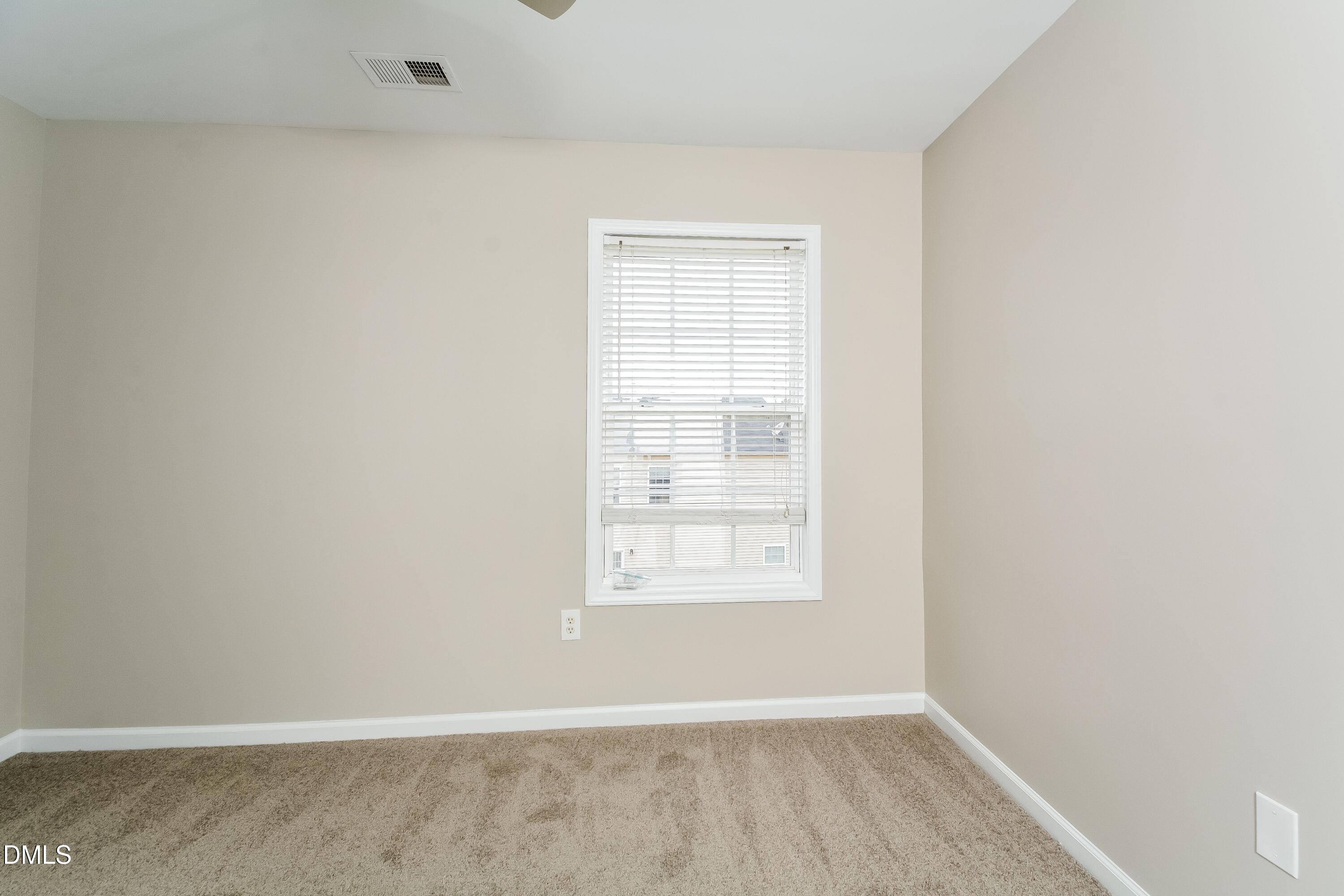 1413 Cozart Street Durham, NC 27704 - Photo 10 of 17 an empty room with wooden floor and windows
