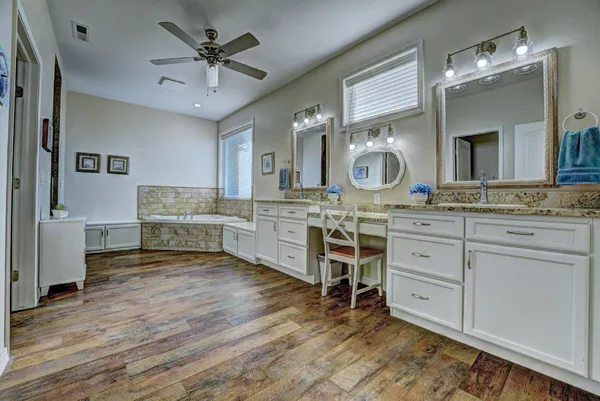 a kitchen with granite countertop cabinets and steel stainless steel appliances