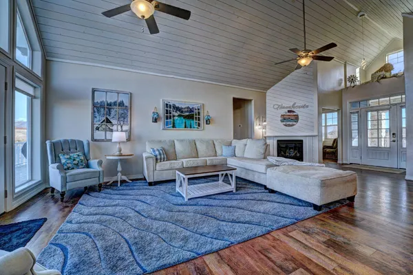 a kitchen with stainless steel appliances granite countertop a sink a stove and a refrigerator