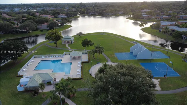 an aerial view of houses with yard