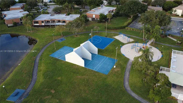 an aerial view of a house with outdoor space