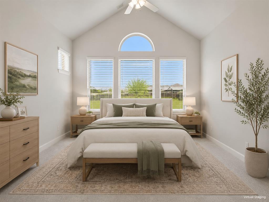 2813 Trinity Ridge Street Mansfield, TX 76063 - Photo 7 of 27 Vaulted ceiling bedroom featuring a large arched window, two vertical windows with blinds, and a ceiling fan