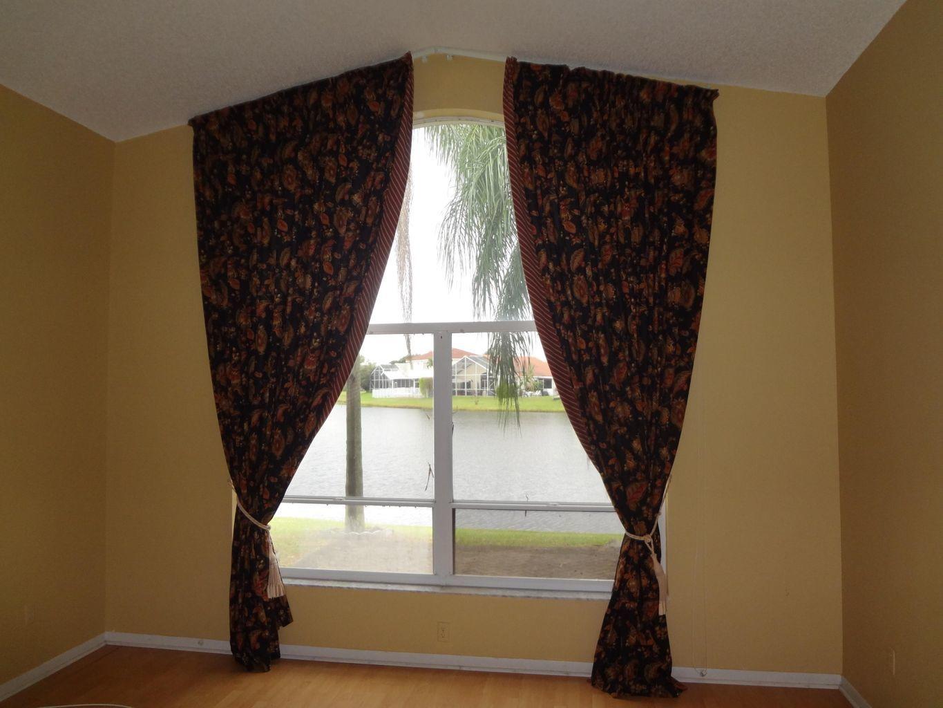 9577 Tavernier Drive Boca Raton, FL 33496 - Photo 15 of 30 Living room to patio to lake