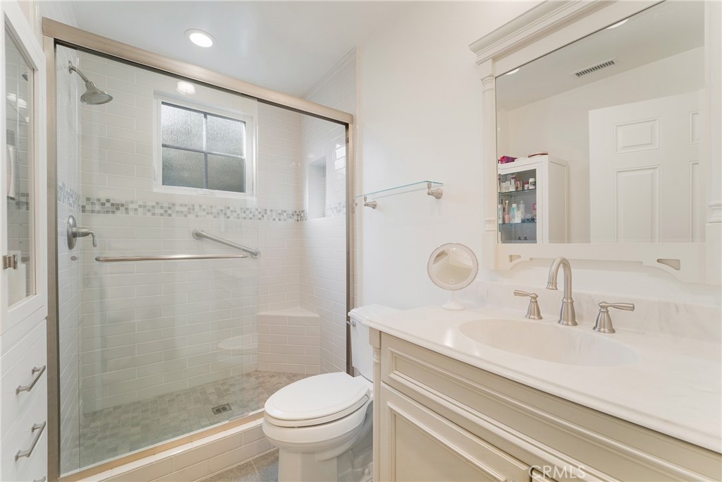 1867 Samar Drive Costa Mesa, CA 92626 - Photo 23 of 38 a bathroom with a sink a toilet and shower