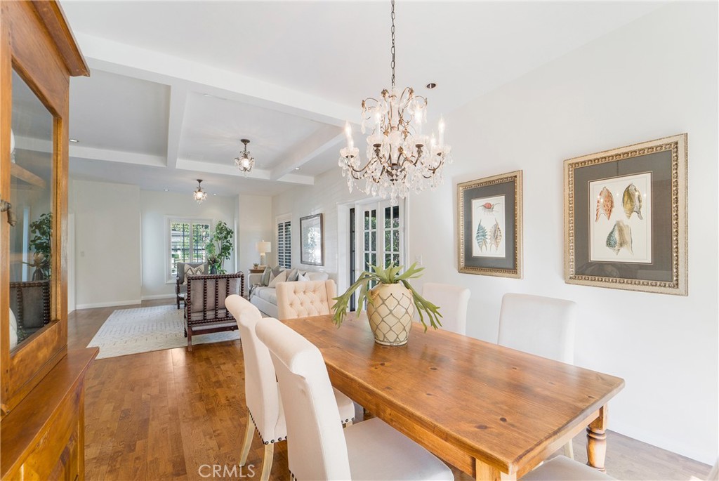 1867 Samar Drive Costa Mesa, CA 92626 - Photo 10 of 38 a view of a dining room with furniture wooden floor and chandelier