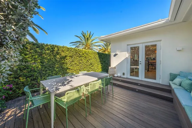 a view of a house with patio and wooden floor