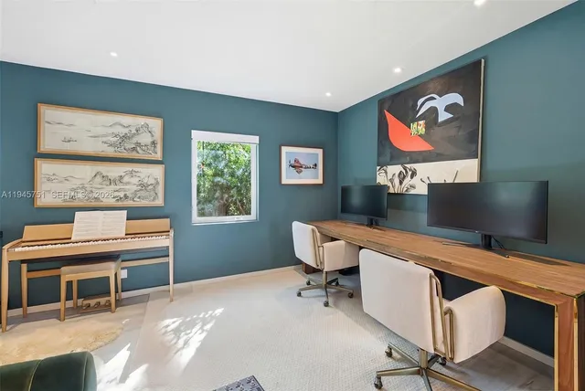 a work room with furniture and a window