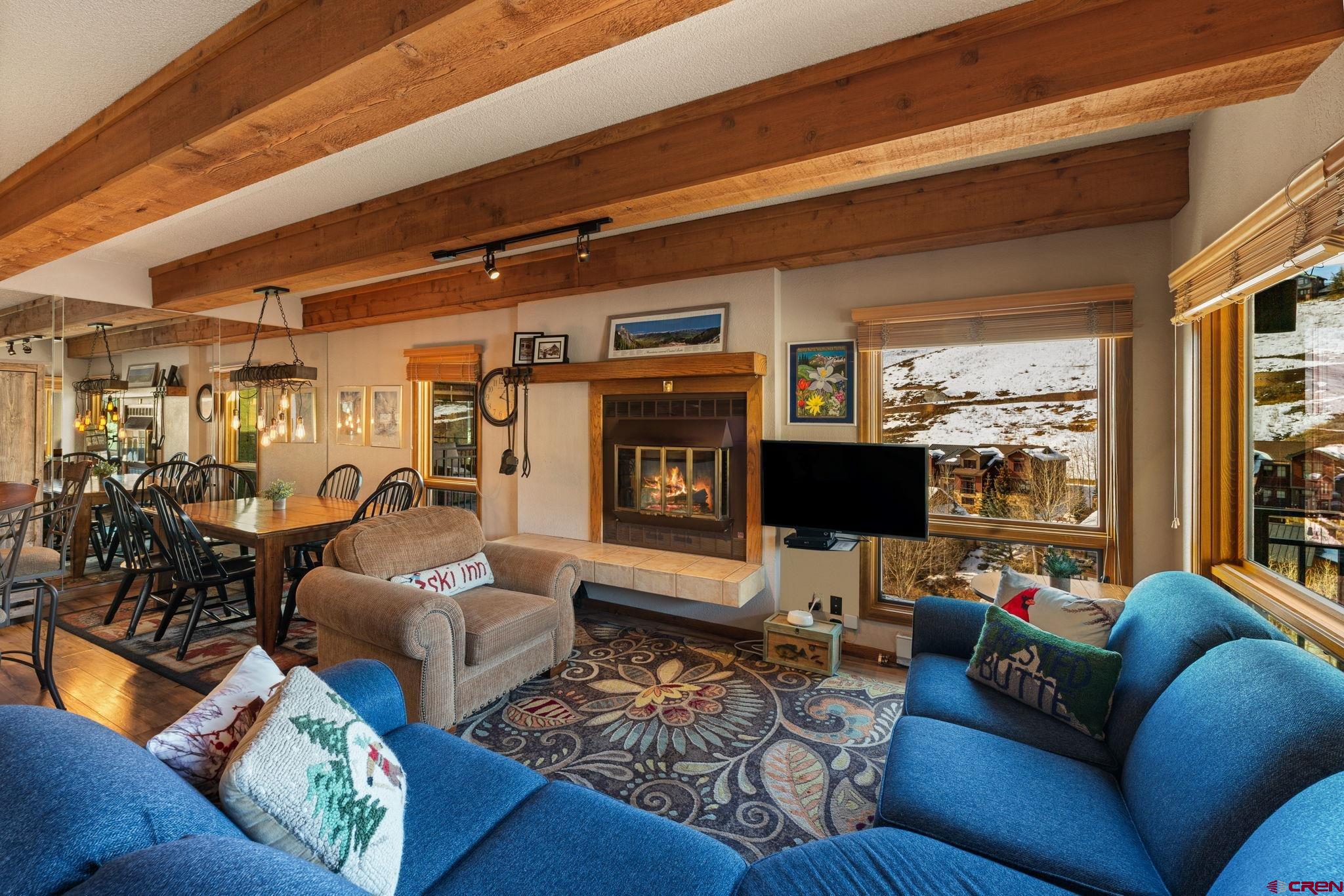 11 Snowmass Road, Unit 638 Crested Butte, CO 81225 - Photo 20 of 41 a living room with furniture and a flat screen tv