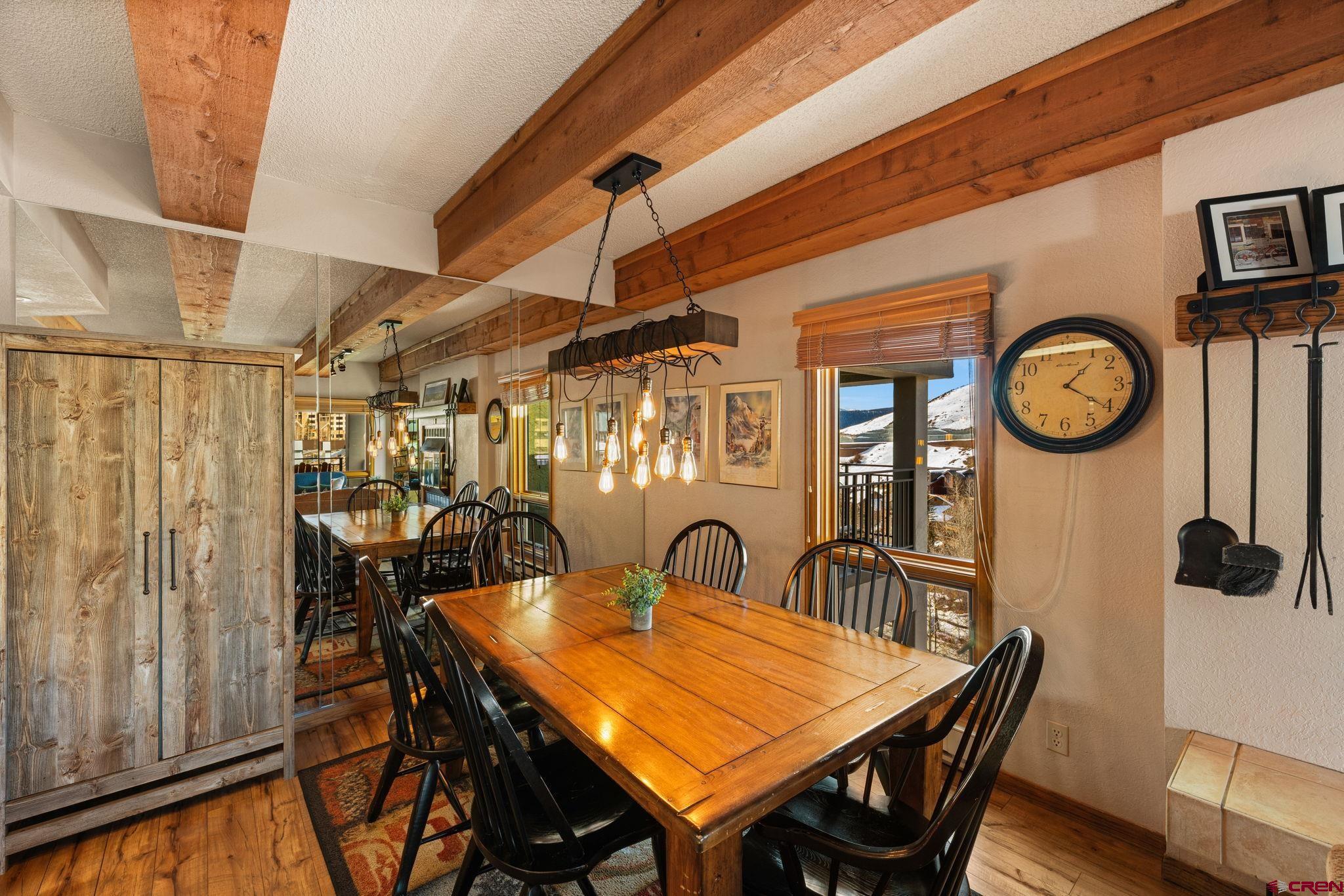 11 Snowmass Road, Unit 638 Crested Butte, CO 81225 - Photo 22 of 41 a view of a dining room with furniture and a chandelier