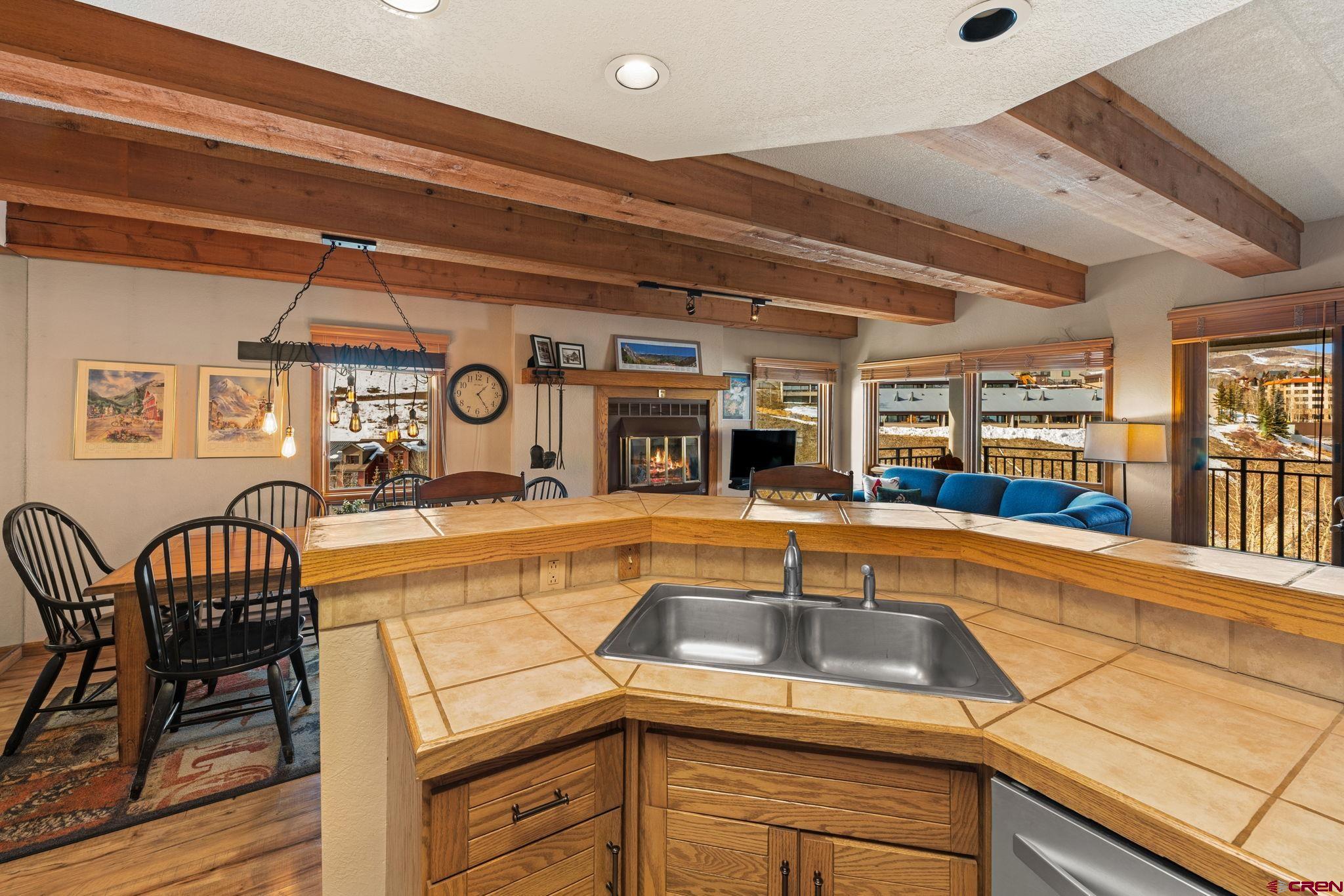 11 Snowmass Road, Unit 638 Crested Butte, CO 81225 - Photo 5 of 41 a kitchen with a table and chairs