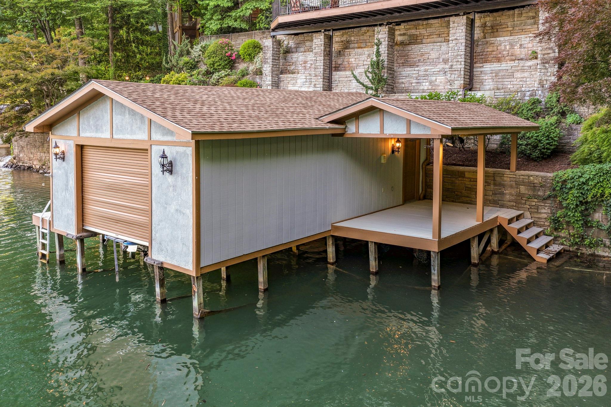 151 Garner Road Lake Lure, NC 28746 - Photo 42 of 48 a front view of a house with a yard balcony and outdoor seating