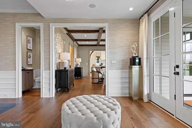 a bedroom with furniture and a wooden floor