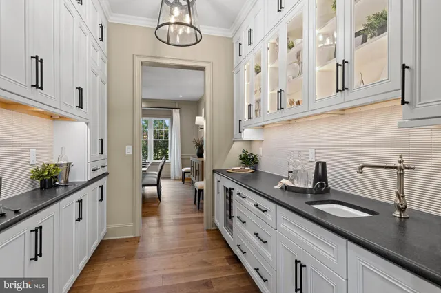 a kitchen with sink and cabinets