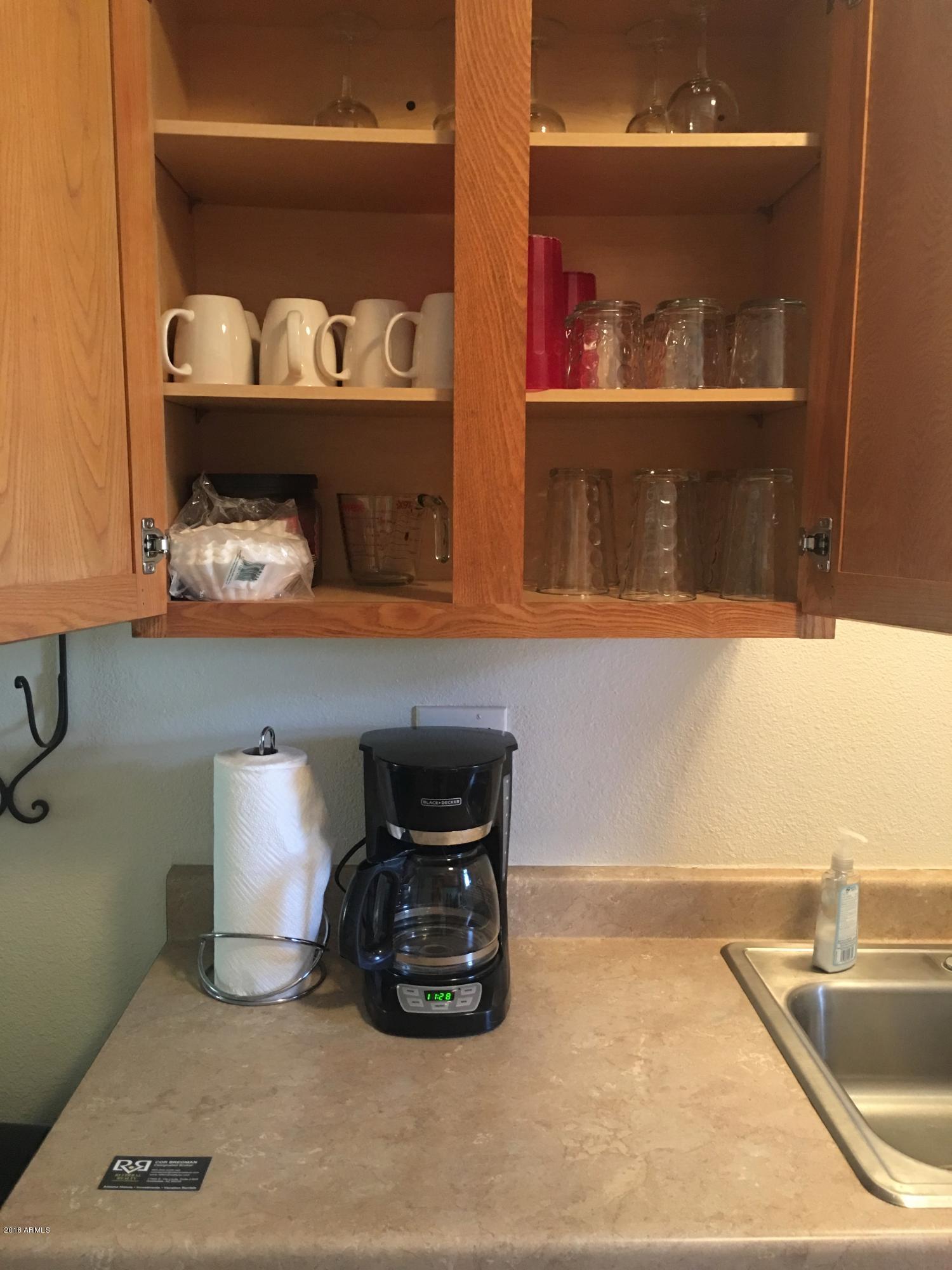 540 South West Road, Unit 7 Wickenburg, AZ 85390 - Photo 13 of 27 a kitchen with a two sink and wooden floor