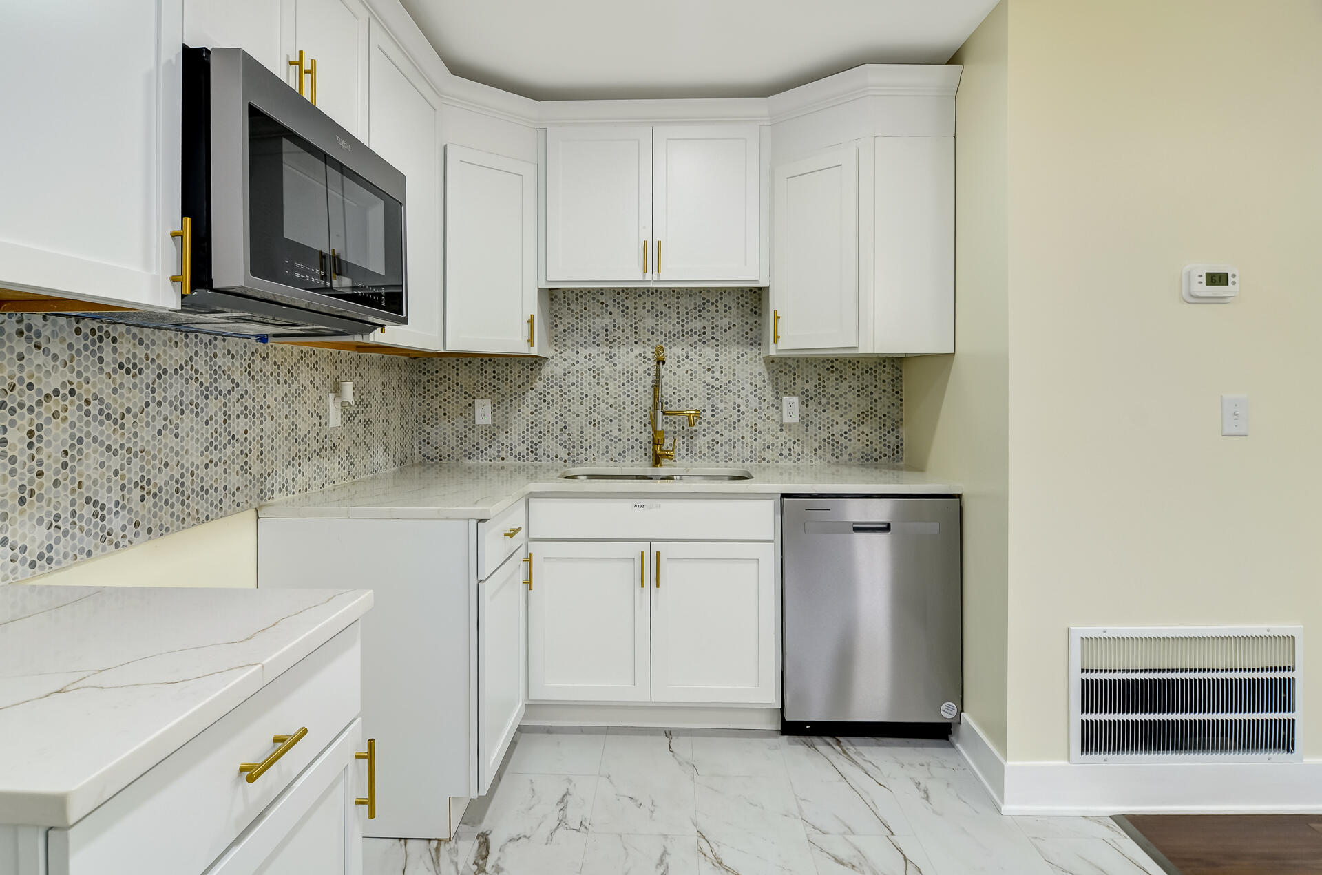 4381 Lincoln Street Gary, IN 46408 - Photo 12 of 24 a kitchen with granite countertop white cabinets stainless steel appliances and a sink
