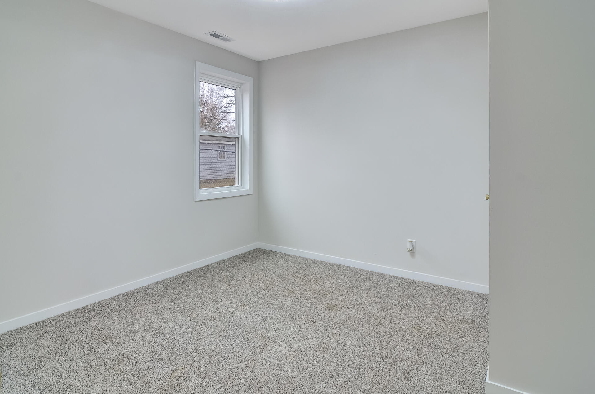 4381 Lincoln Street Gary, IN 46408 - Photo 18 of 24 a view of an empty room with a window
