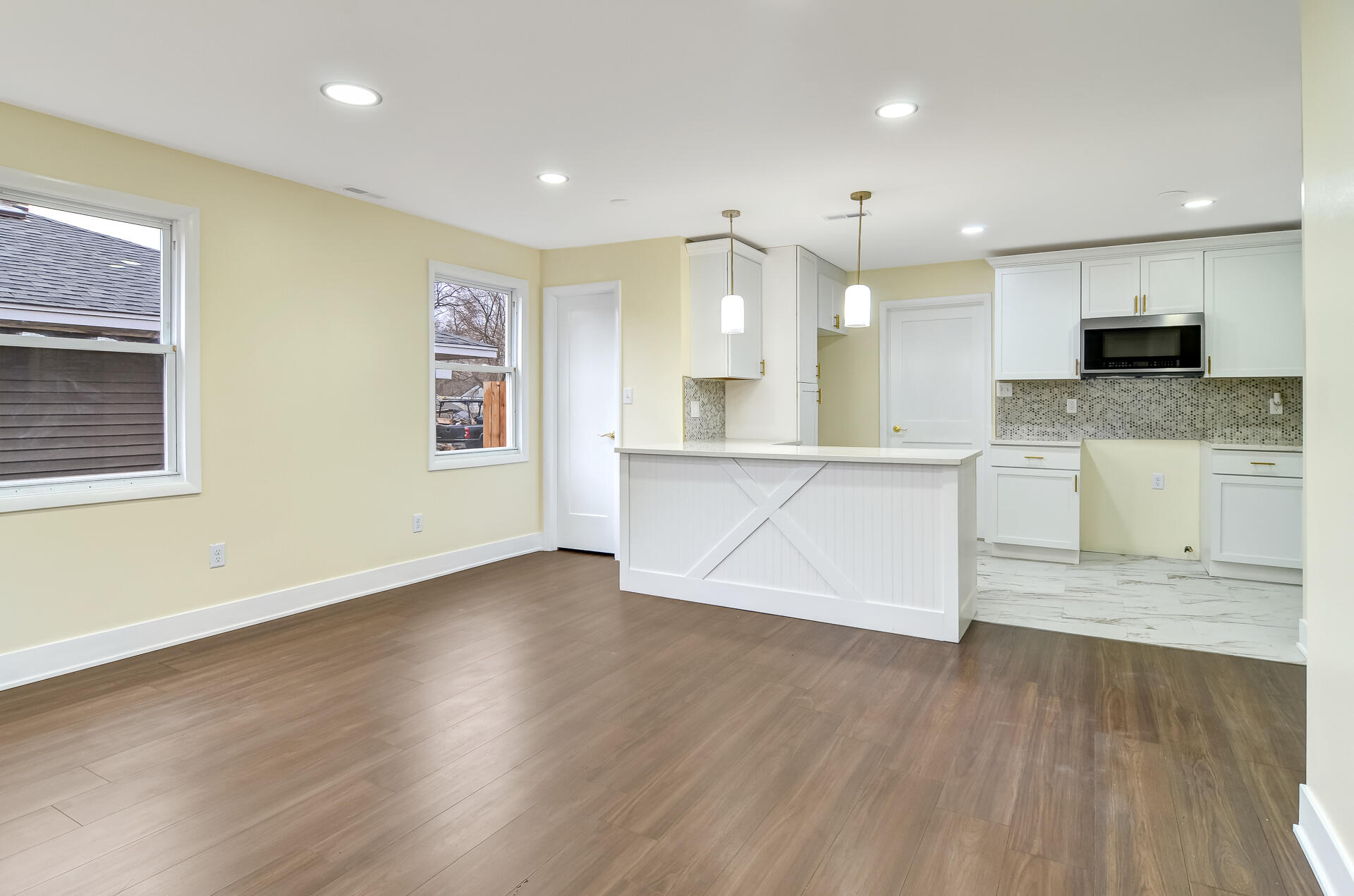 4381 Lincoln Street Gary, IN 46408 - Photo 3 of 24 a view of kitchen with wooden floor and window