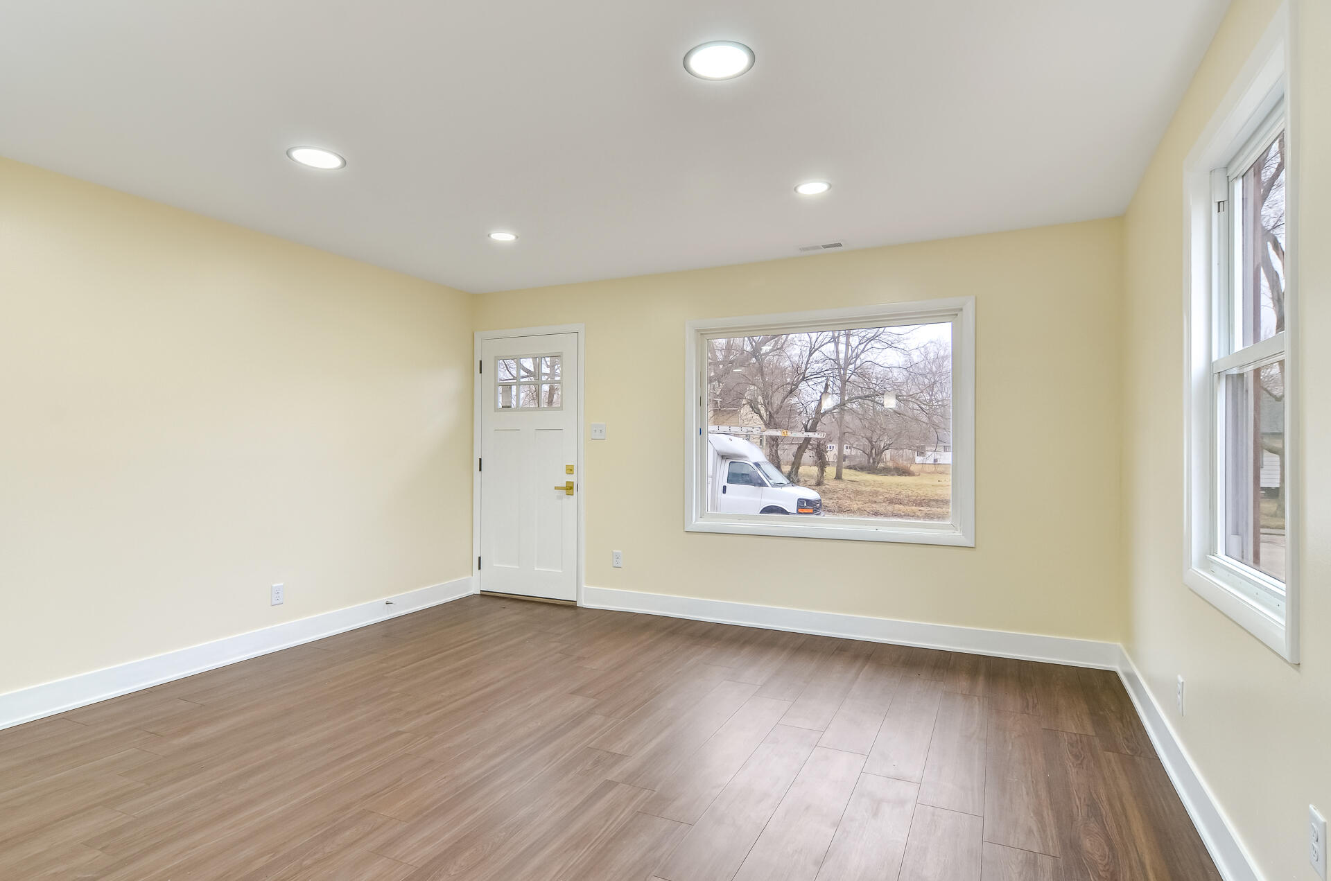 4381 Lincoln Street Gary, IN 46408 - Photo 4 of 24 an empty room with wooden floor and window