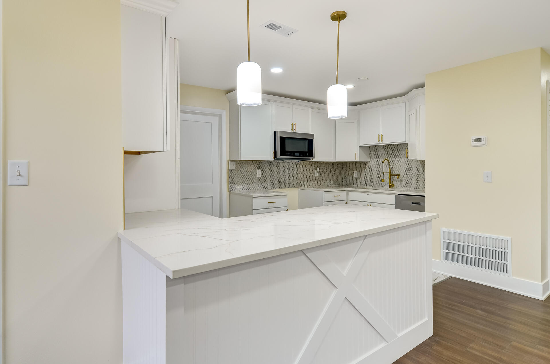 4381 Lincoln Street Gary, IN 46408 - Photo 8 of 24 a view of a kitchen with a sink and a chandelier