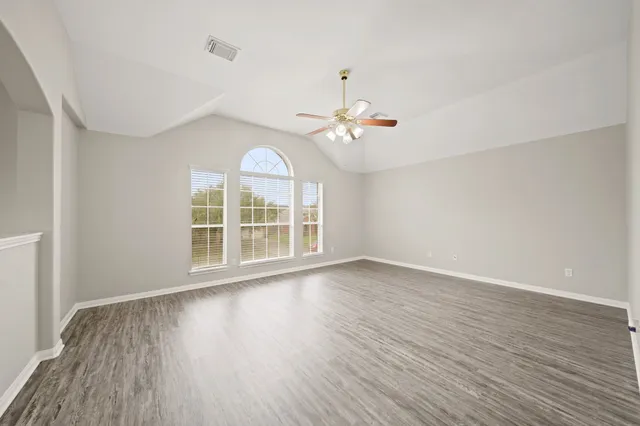 a view of an empty room with a window